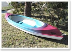 Moulded NFP fibreglass hull on a lawn, representative of the seven NFP dinghy models